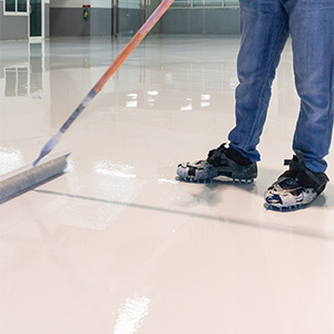 Installing specialty coating on concrete floor