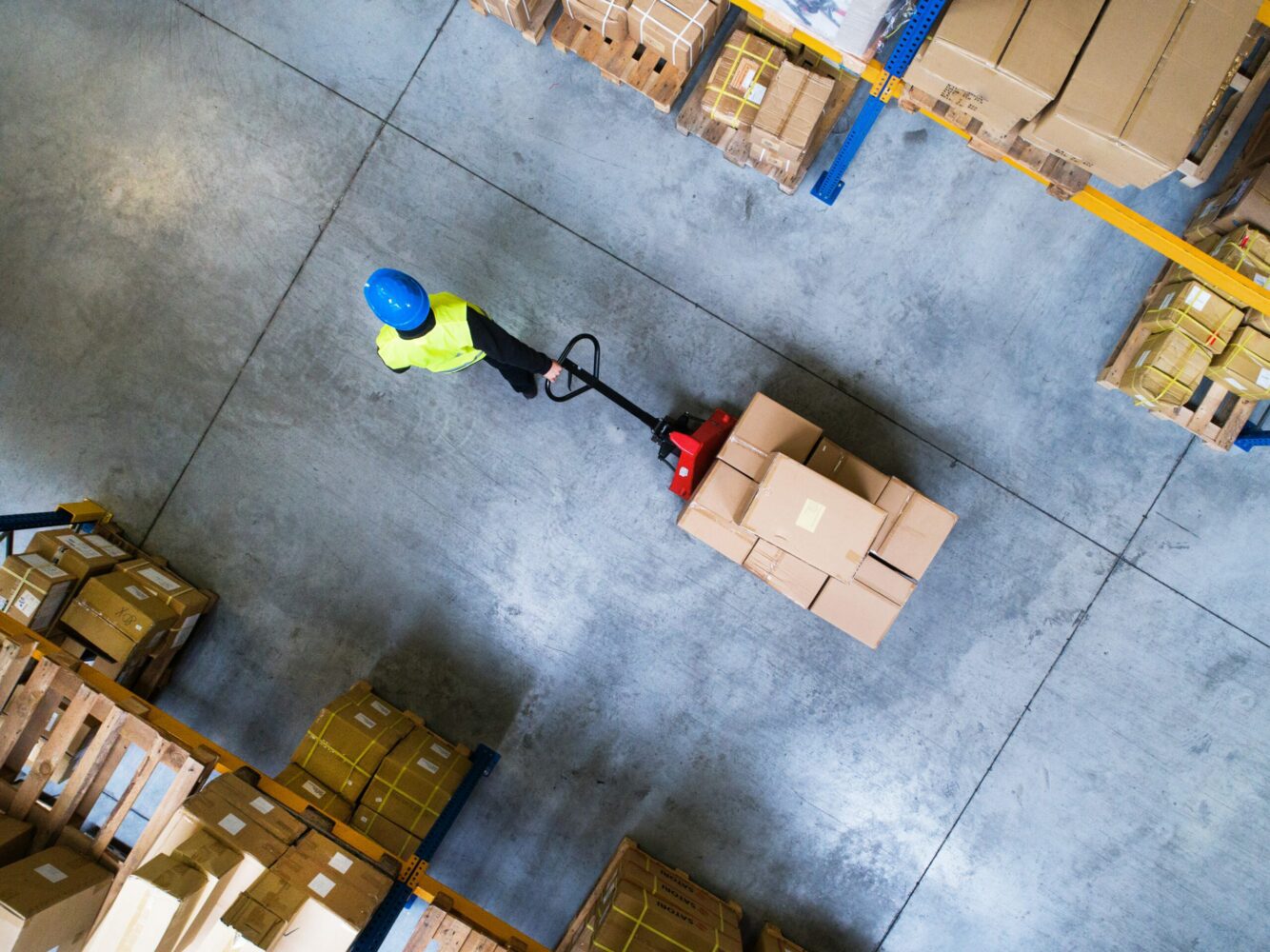 Man pulling cart with boxes on it