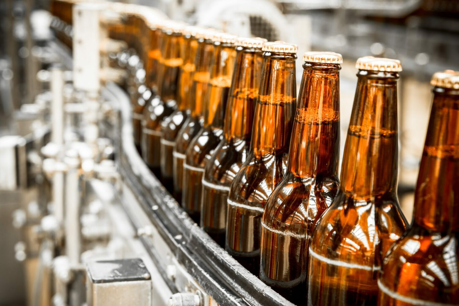 Assembly line of brown bottles 