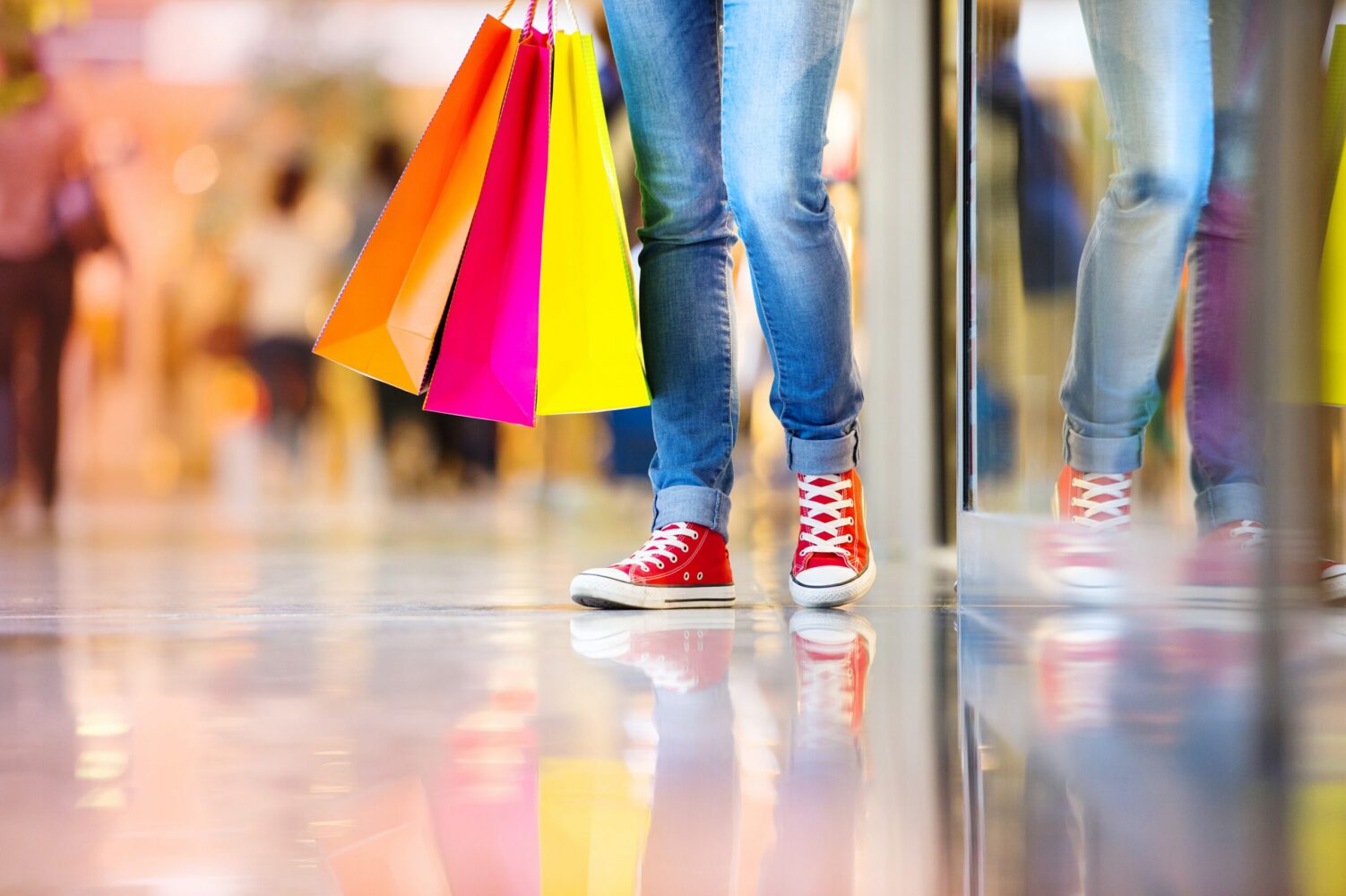 Person standing with shopping bags