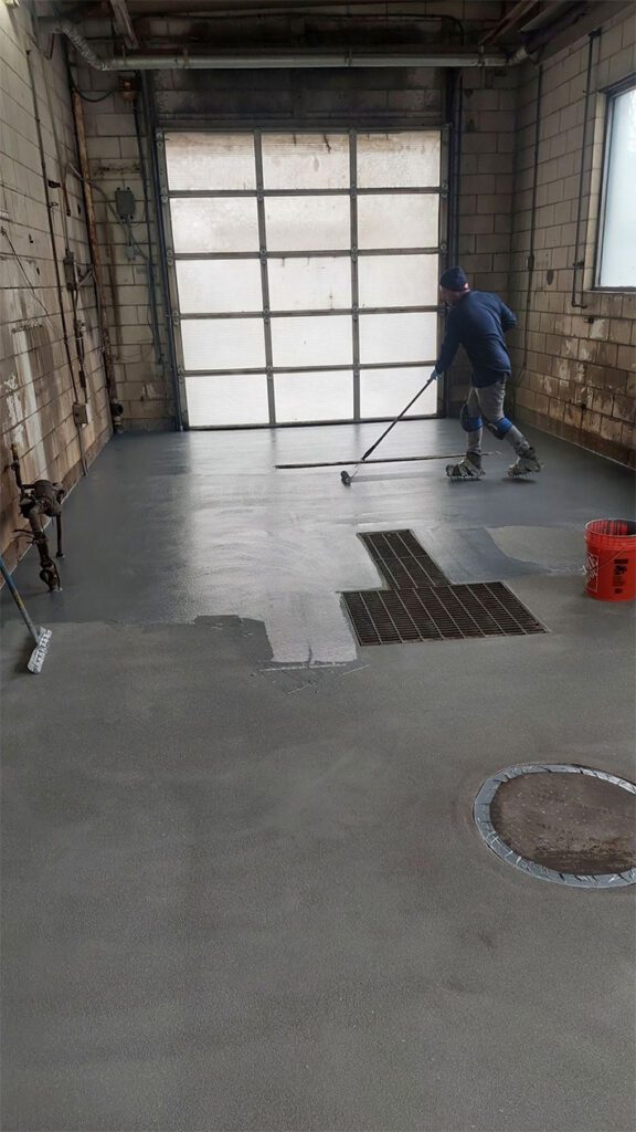 applying urethane cement to floor in carwash in aurora, co