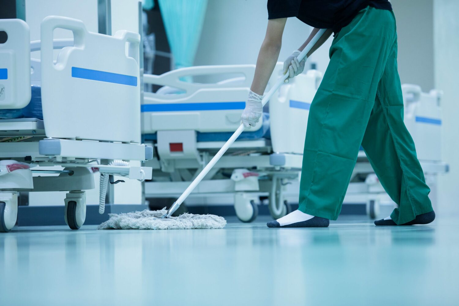 Medical staff cleaning epoxy flooring in hospital