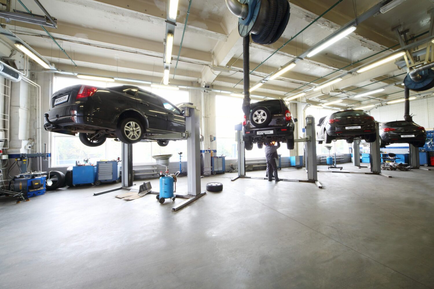 Cars lifted in a service bay