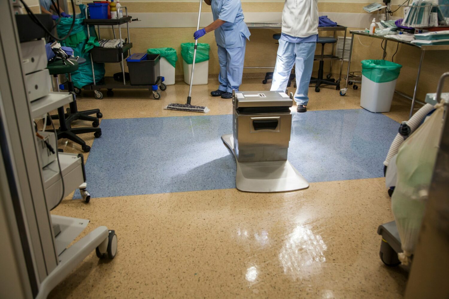Medical staff cleaning a hospital room