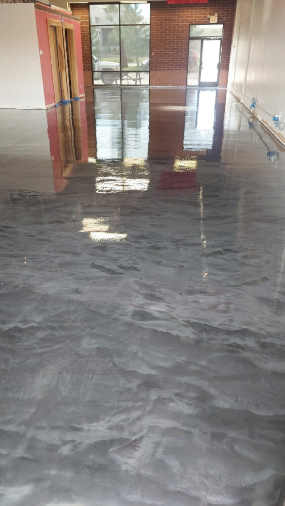 gray metallic epoxy floor in commercial warehouse