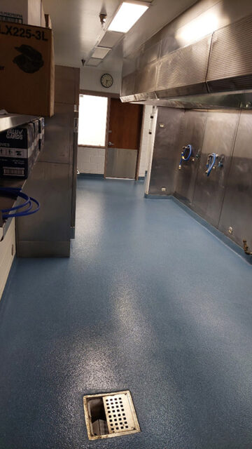 blue epoxy floor in commercial kitchen area