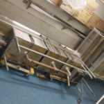 Dark blue epoxy floor in commercial kitchen