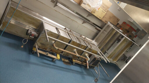 Dark blue epoxy floor in commercial kitchen