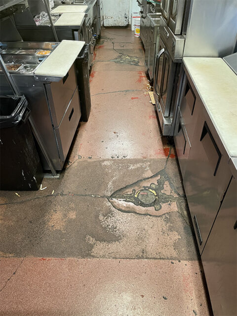 close up of damaged epoxy kitchen floor