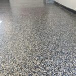 Blue black white flake epoxy floor in residential garage